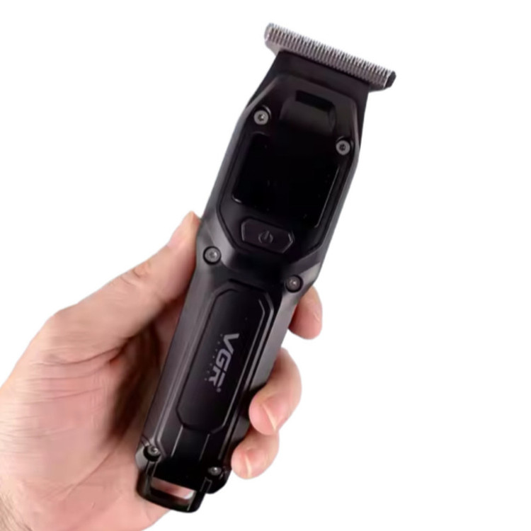 ماشین اصلاح موی سر و صورت وی جی ار مدل V-964 با تیغه کربن استیل، باتری لیتیومی 600 میلیآمپر، نمایشگر وضعیت باتری، عملکرد توربو، طراحی ارگونومیک و 3 شانه خط زن سایز 1، 2 و 3 میلیمتر